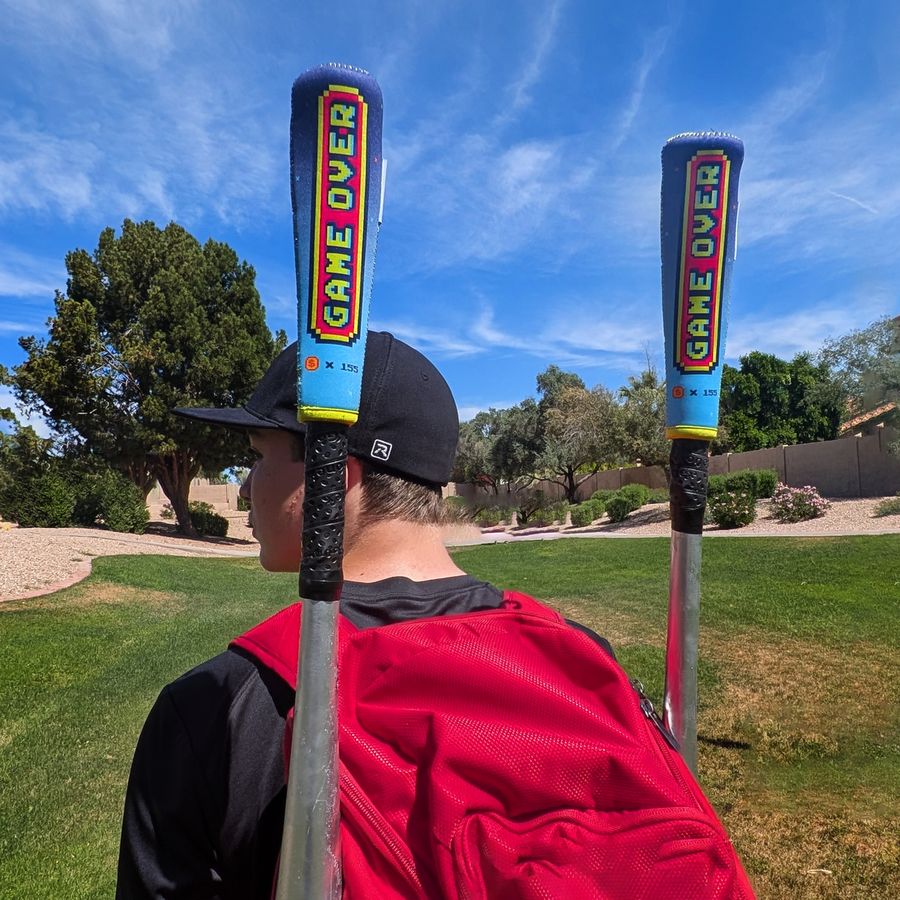Player carrying Gamer covered bats in a backpack